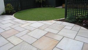 Patio pavers with great grass edge design by Sutherland Landscape